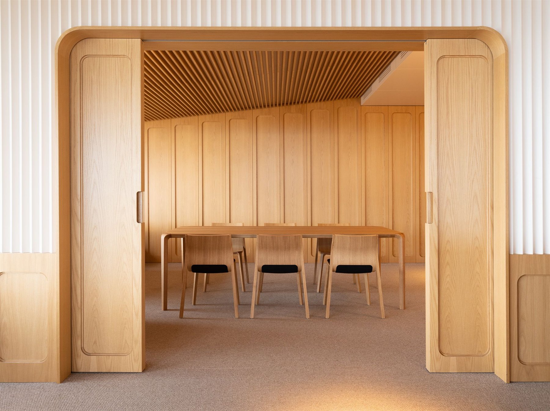 Ondarreta wood dining table and chairs in a warm timber interior